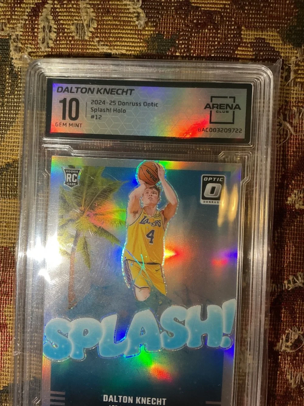2024-25 Panini Donruss Optic Splash Dalton Knecht #12 Holo rookie grade Arena 10